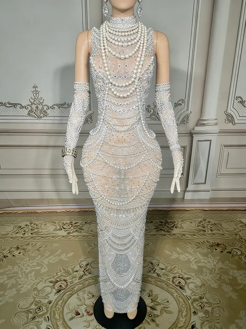 Beaded White Mermaid Gown – High-Neck Sleeveless Style Featuring Open Back Detail and Floor-Sweeping Hemline