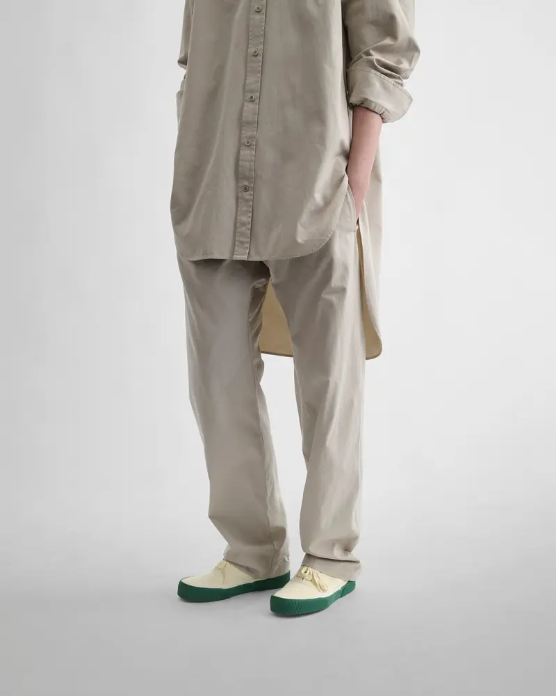 Stone Cotton Arch-Trouser With Curved Leg Design