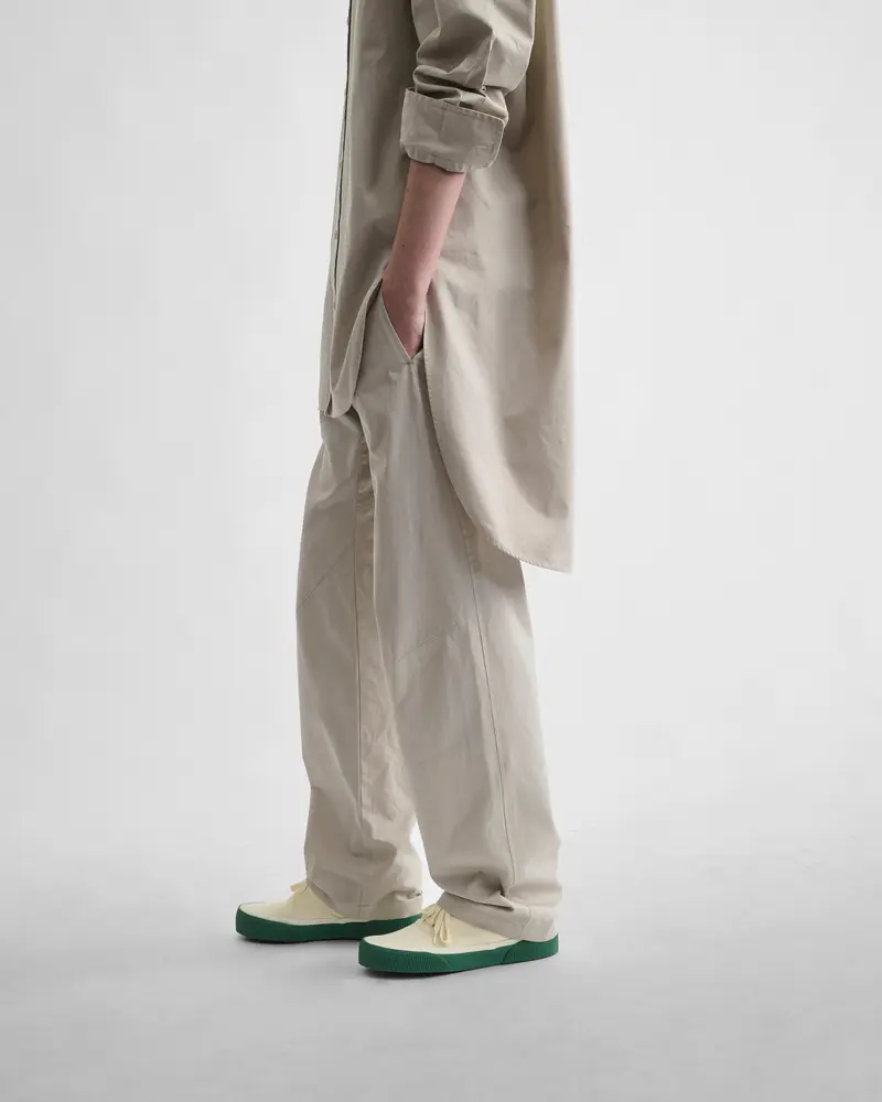 Stone Cotton Arch-Trouser With Curved Leg Design